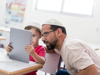 "A teacher guiding students with Sunnah-based learning, integrating Islamic principles in modern education."