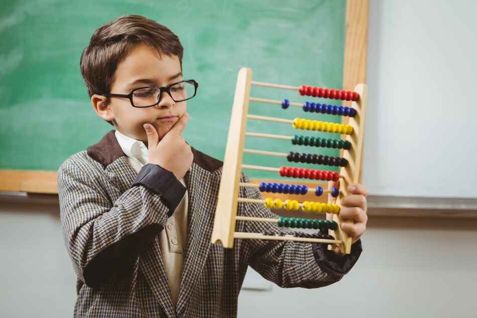 Child using an abacus .